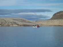 Hanna, Elin, and Mike all coring in a small boat...