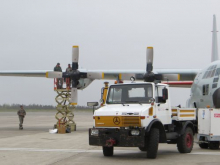 The military attempting to fix the wing on the C130