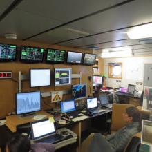 The walls of monitors at the dry lab watch station.