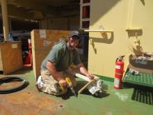 Matt Fixing the hydraulic pump.