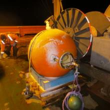 The buoy with its transmitter and beacon light.