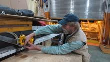 Barry Bjork completing the packing of some electrical equipment