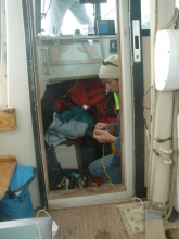 Dunton makes a field repair on the bilge pump used for mud washing.