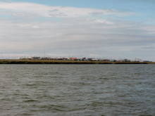 Kaktovik as seen from the east.  There is no snow fence on this side.