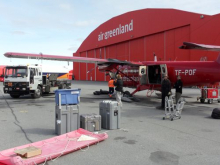 Unloading Swiss Camp cargo and loading AWS cargo.