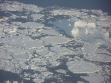 Fiord with sea ice and icebergs near Kulusuk, east Greenland.