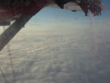 View from the plane while flying across the Greenland ice sheet.