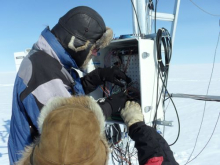 Dr. Konrad Steffen and his son Simon rewiring the AWS.