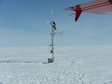 Serviced Humboldt AWS with battery on snow surface.