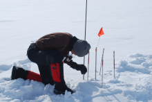 Taking measurements at the Smiley site.