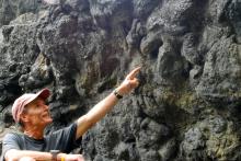 Mr. Wood showing a dinosaur footprint