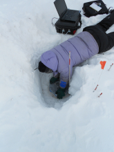 Elizabeth putting the sampling cover on.