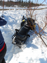 Snowmobile stuck in the deep snow