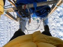 Standing on the sled.