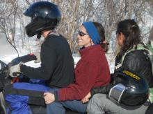 Riding the snowmobile