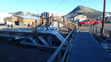 Crossing a bridge over exposed pipes at McMurdo