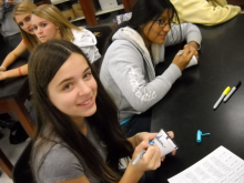 8th graders decorating cups