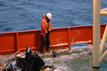 Brett cleans the deck of ice