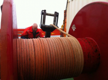 Jim Ryder connecting the rope on the winch drum to the mooring cable