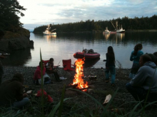 Fishing families gather around a campfire in Alaska