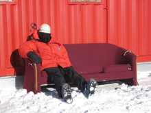 Dr. Tom Gaisser sits on a couch in drill camp.