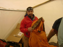 Seth showing a sleeping bag that he is testing for Backpacker Magazine.