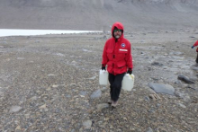 Dr. Jeb Barratt hauling water