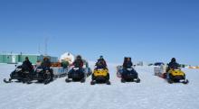 Scientists on snowmobiles