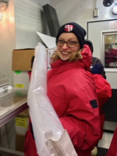 PolarTREC teacher, Lauren Adamo, holding an ice core.