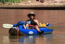 Lesley floating the San Juan in her inyak