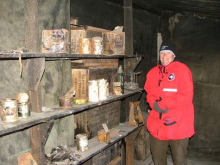 Lesley standing in the store room of Scott's Discovery Hut.