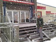 Phil going into the supermarket during one of the snow squalls.