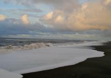 The Chukchi sea washes up the black beach near NARL in Barrow. 