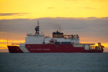 The U.S. Coast Guard Cutter Healy offshore downtown Barrow Alaska. 