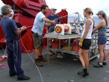 PreppingSled:  The team preparing the deep tow sled for its deployment.