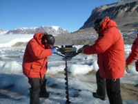 Tyler and Justin drilling a hole in Lake Joyce