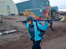 Megan hiking her skis over to Scott Base.