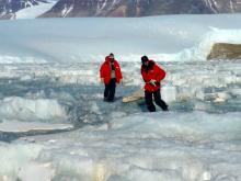 Tyler and Justin wrestling sled over rough lake ice- in manner of cantankerous donkey.