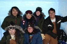 JSEP group posing in the backlit snow pit.