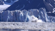 Calving iceberg on Kronebreen glacier