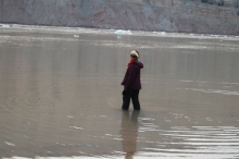 Daksha wades into the fjord.