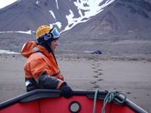 Liz holds the boat in position