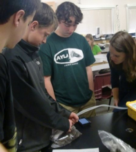 Students and soil bag