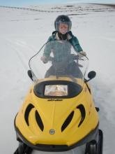 Caitlin driving the snow machine