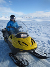 Melissa driving the snow machine