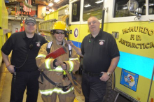 Michelle tries on a firefighter uniform