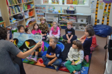 Elementary school students read about Antarctica.