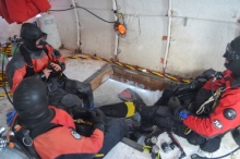 Terry Palmer, Brenda Konar and Steve Rupp in the dive hole