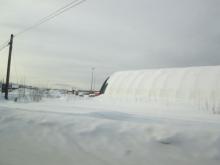 Snow accumulation along the road to UAF Museum if the North.