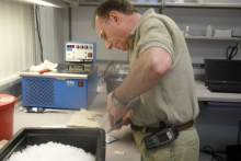 Dr. Steven Untracht scanning supplies at Palmer Station, Antarctica